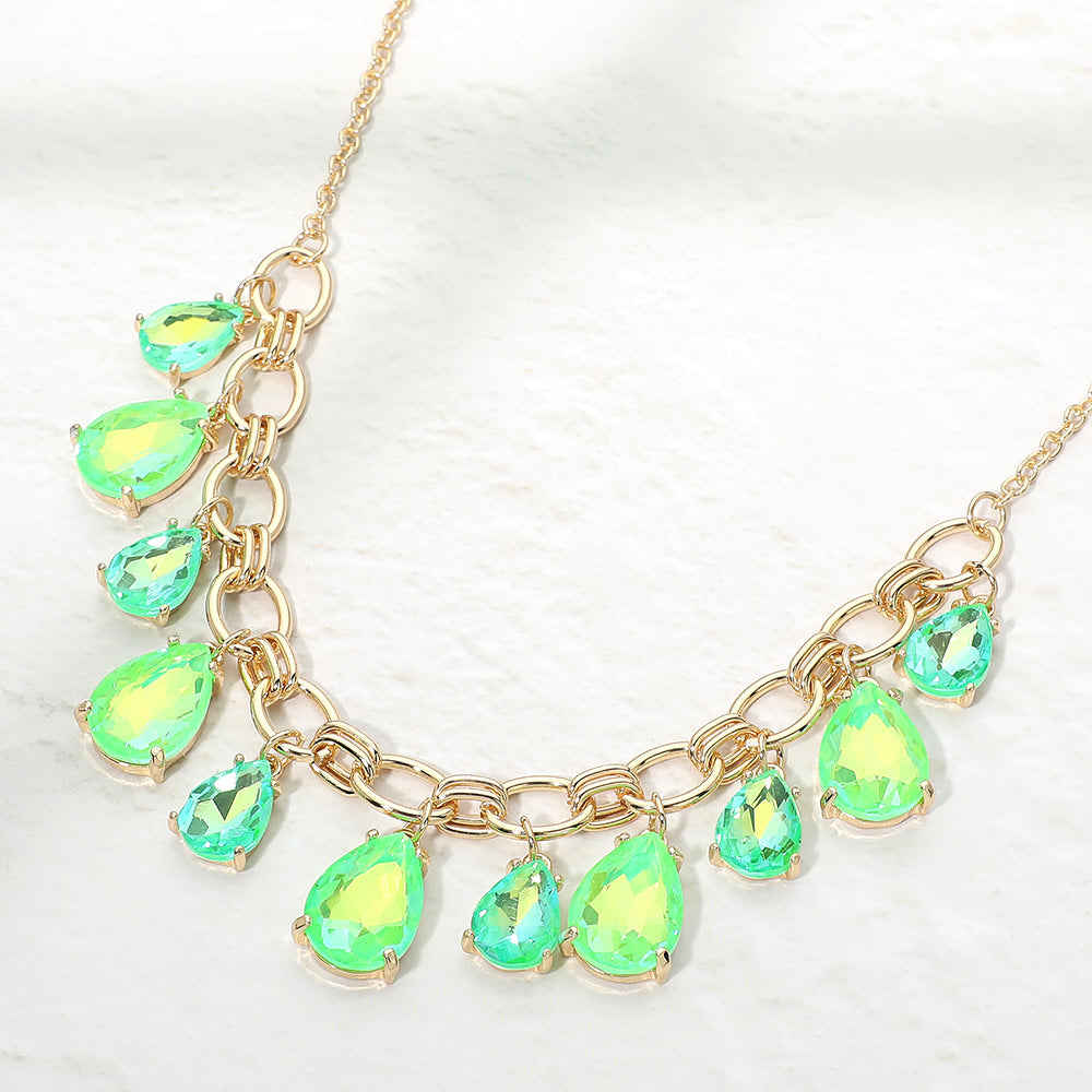 Neon Green Teardrop Necklace on gold with green teardrop-shaped gemstones on a white background