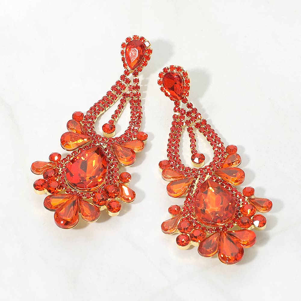 Orange chandelier statement teardrop stone cluster evening earrings on gold on white background