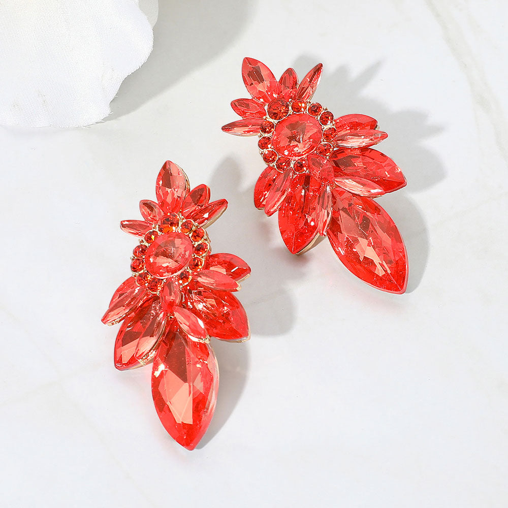 Orange marquise stone cluster drop earrings on gold on a white background