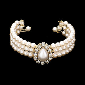 Matching Cream Pearl 3-Row bracelet with a large teardrop cream pearl as a center decor on a black background