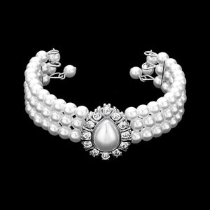 Matching white Pearl 3-Row bracelet with a large teardrop white pearl as a center decor on a black background