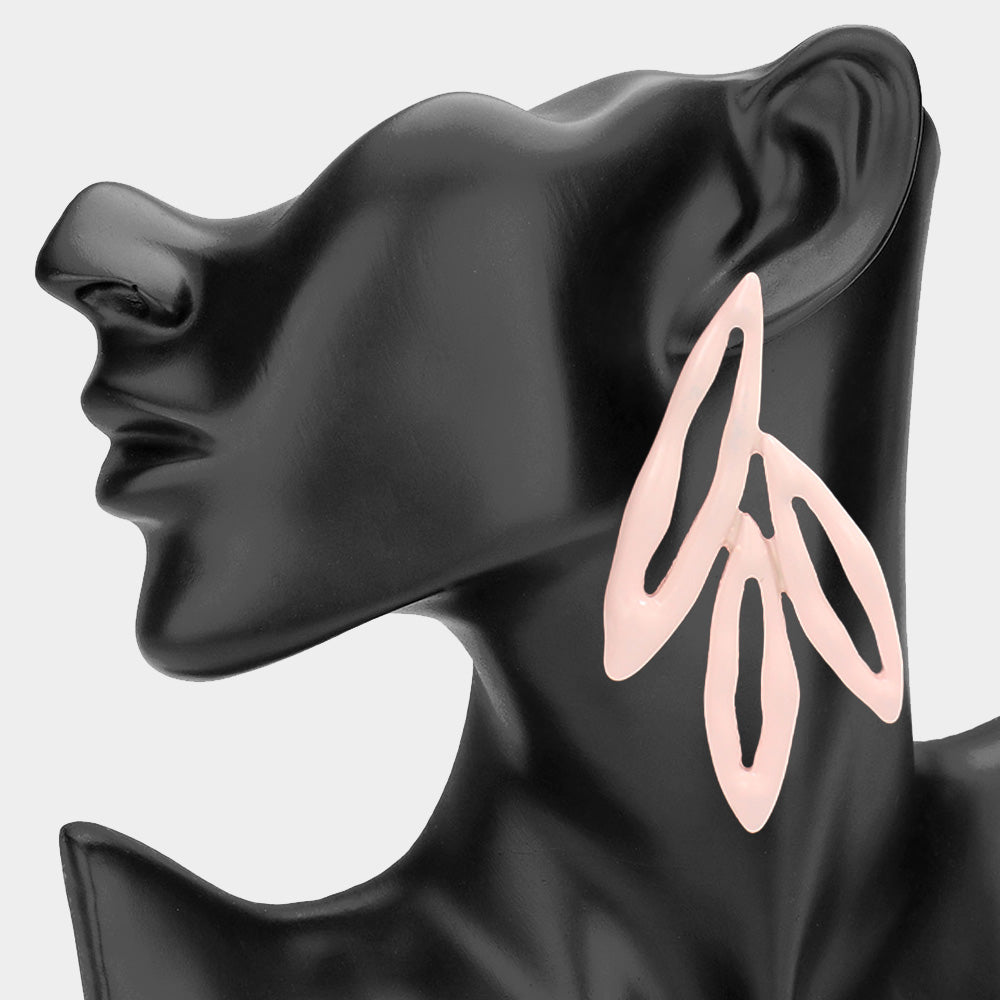 Peach abstract geometric fun fashion statement drop earrings displayed on a black mannequin