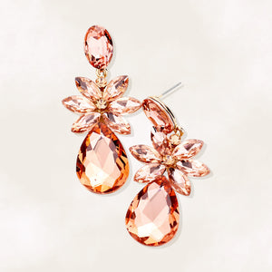 Peach crystal flower teardrop earrings on gold displayed on white background