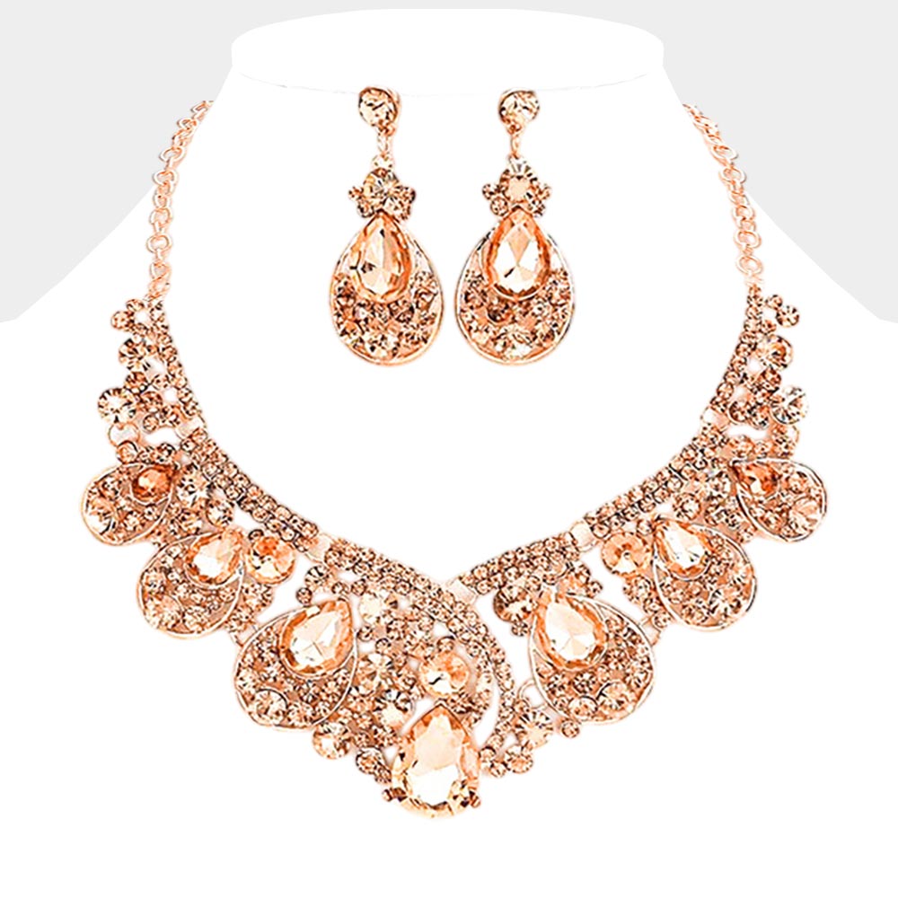 Peach crystal teardrop necklace set on rose gold displayed on white background