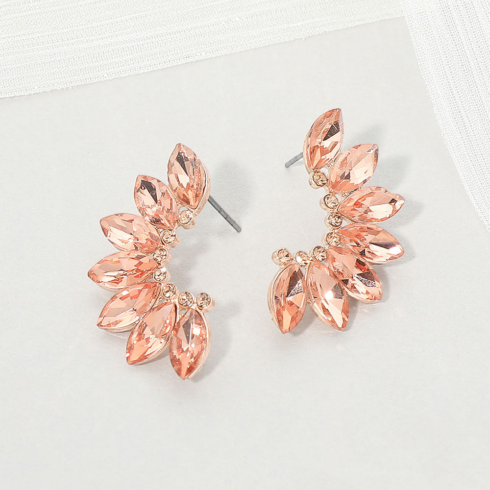 Peach crystal marquise wing-inspired earrings on rose gold with layered marquise stones, displayed on a white background.