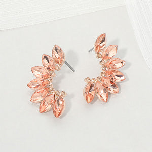 Peach crystal marquise wing-inspired earrings on rose gold with layered marquise stones, displayed on a white background.