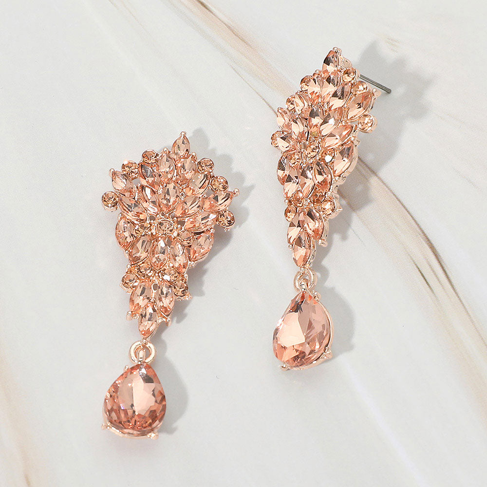 Peach floral marquise cluster teardrop drop earrings on rose gold on white marble background