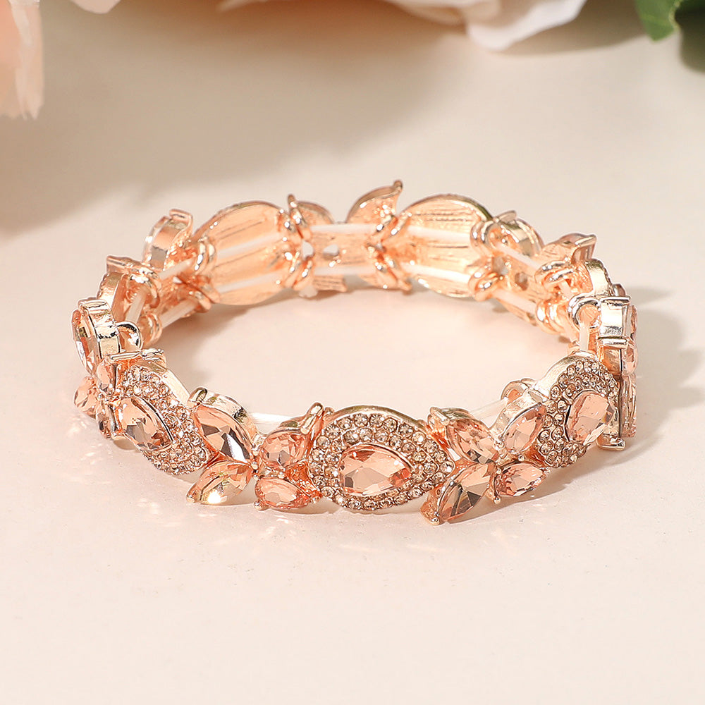 Peach rhinestone marquise bracelet on rose gold for weddings or pageants on a peach background