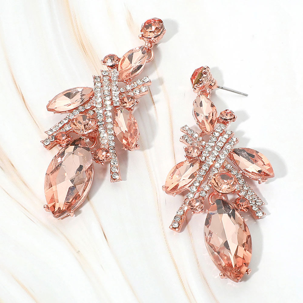 Peach marquise stone and rhinestone cluster drop earrings on rose gold on white marble background