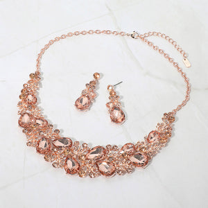 Peach teardrop leaf branch statement necklace set on rose gold on a white marble background on rose gold