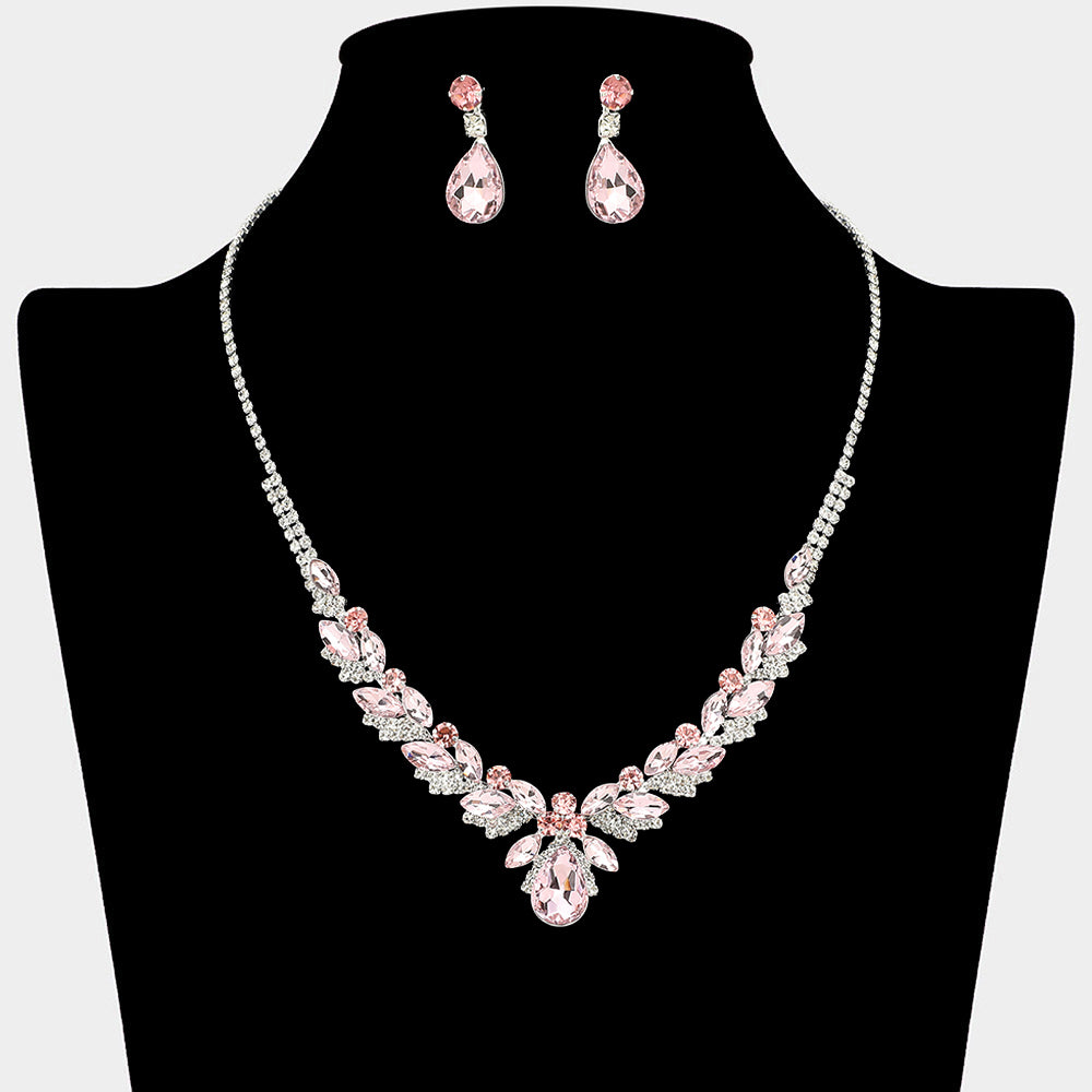 Pink teardrop marquise prom necklace set on silver with matching earrings displayed on a black mannequin bust on a white background.