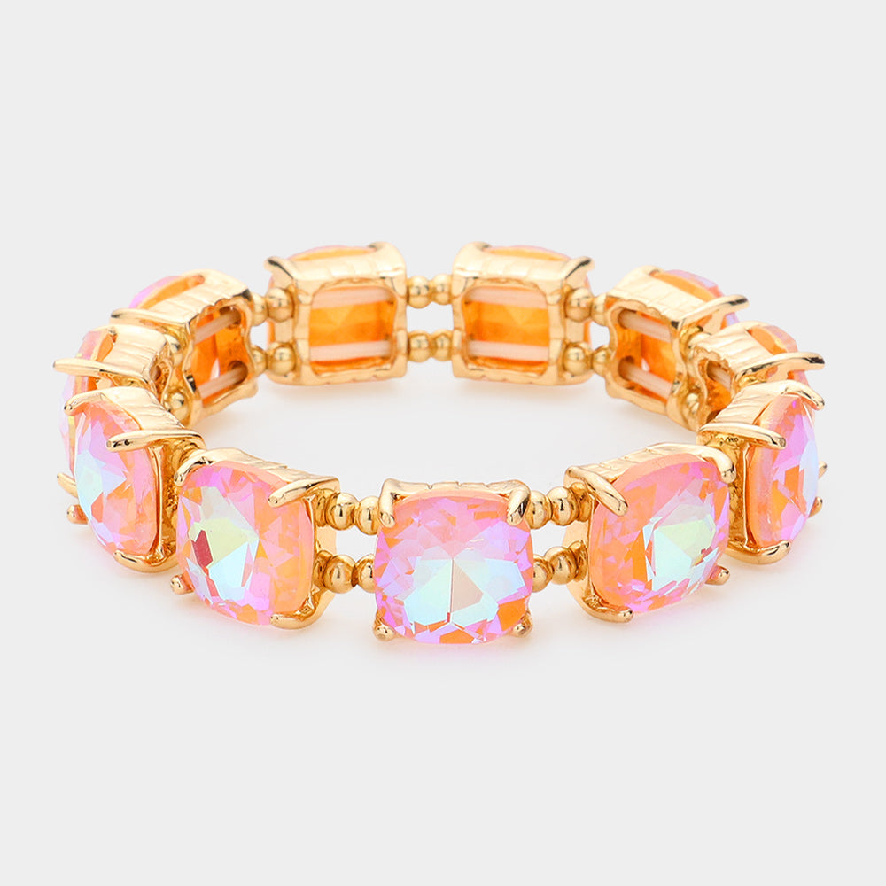 Pink AB cushion square stone stretch evening bracelet on gold, iridescent statement bracelet for evening wear on a white background