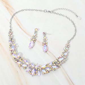 Pink AB marquise stone cluster prom and evening necklace set on silver on white marble background