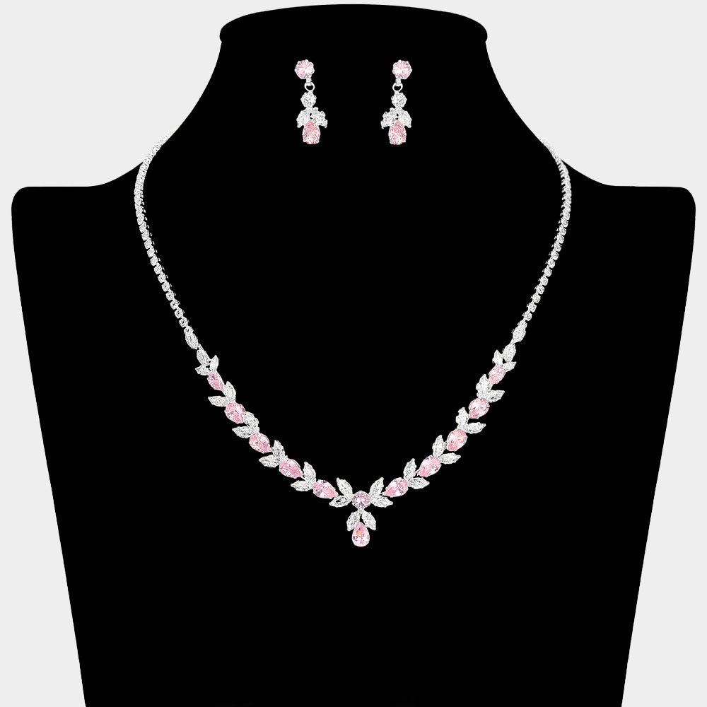 Pink and clear crystal delicate necklace set on silver with alternating marquise stones, a small center drop, and matching drop earrings, displayed on a black jewelry bust.