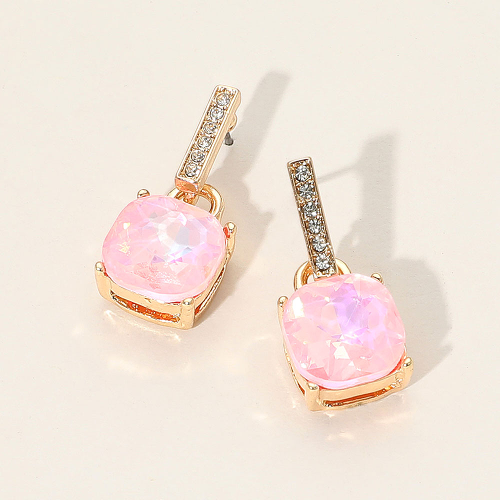 Pink crystal cushion square dangle earrings on gold with a large cushion-cut stone suspended from a narrow crystal-lined bar, displayed on a white background.