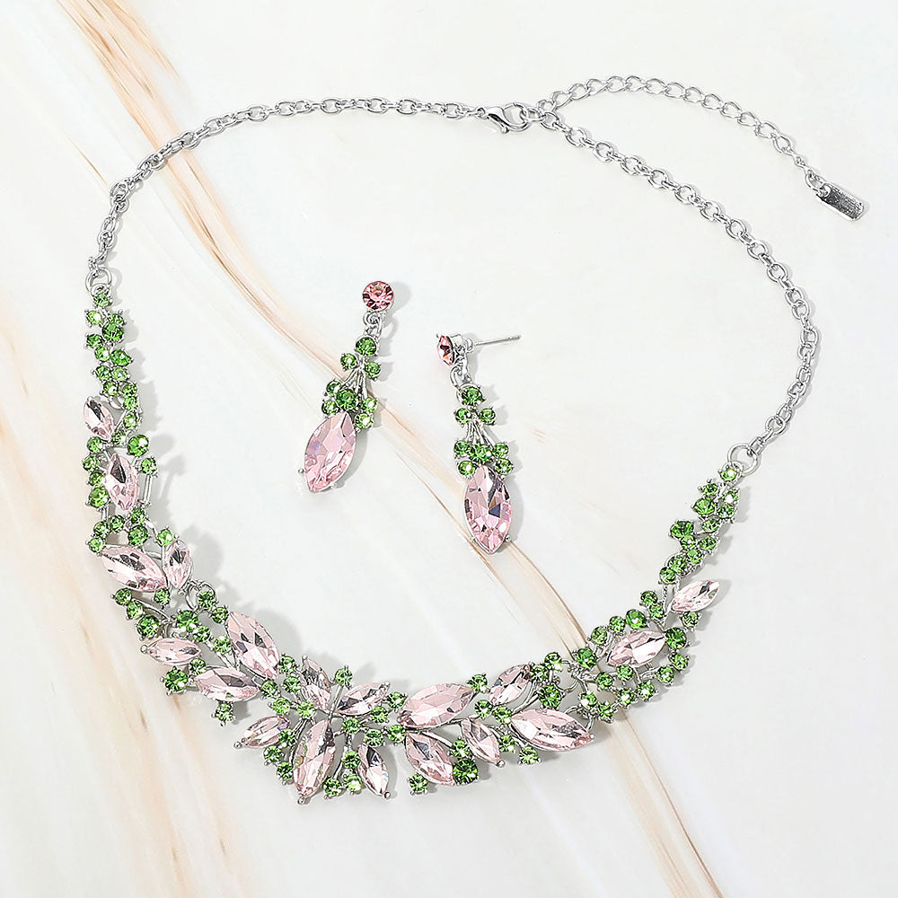 Pink and green marquise stone cluster prom and evening necklace set on silver on white marble background