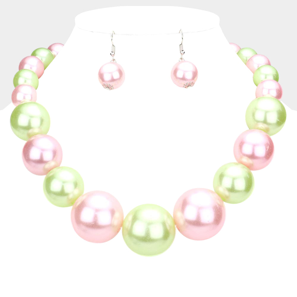 Light Pink and Green Oversized Graduated Pearl Glossy Statement Necklace Set on silver on a white background.