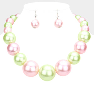 Light Pink and Green Oversized Graduated Pearl Glossy Statement Necklace Set on silver on a white background.