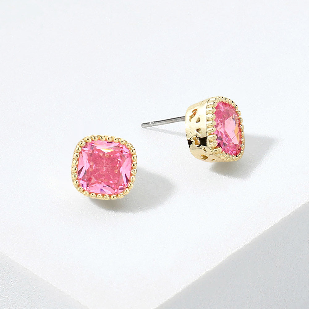 Pink square CZ stud earrings on gold displayed on white background