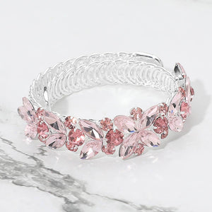 Pink marquise floral crystal bracelet on silver with adjustable fit, elegant statement jewelry for prom and evening wear on a marble background