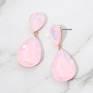 Pink opal crystal double teardrop dangle earrings on gold displayed on a white marble background.