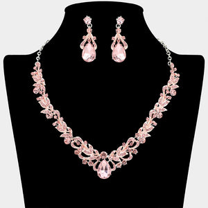 Pink crystal teardrop leaf necklace and earring set styled for prom or evening wear, shown on a black mannequin bust on a white background