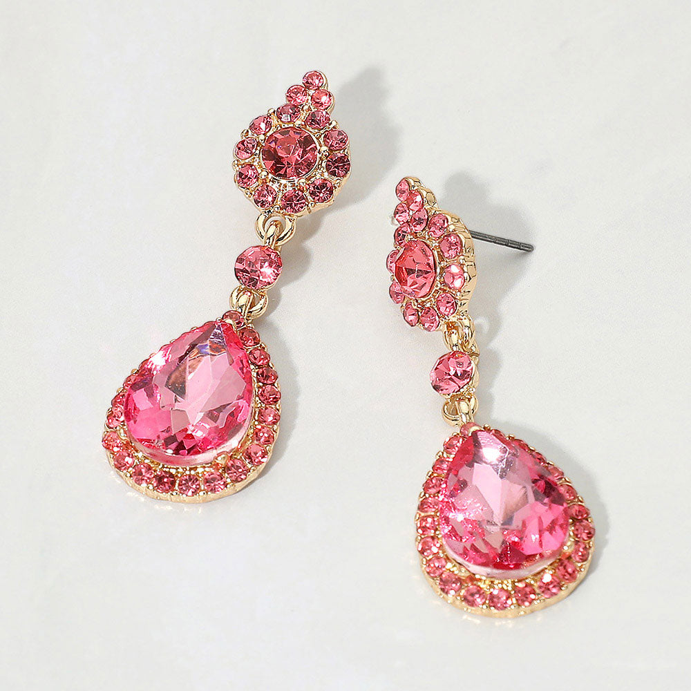 Pink teardrop vintage crystal drop formal and evening earrings on gold on white background