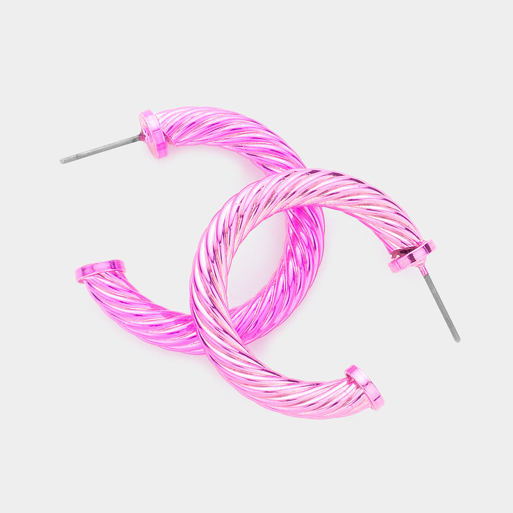 Pink twisted rope texture hoop earrings 1.25 inch shown on a white background