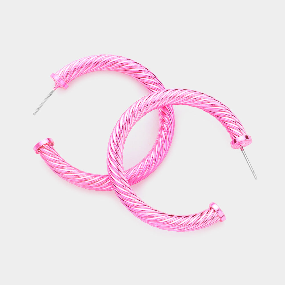 Pink twisted rope texture hoop earrings 1.5 inch shown on a white background