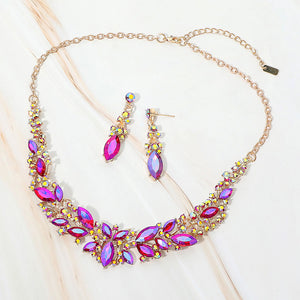 Purple AB marquise stone cluster prom and evening necklace set on gold on white marble background