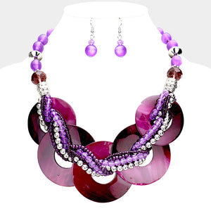 Purple chunky round link statement necklace set with matching earrings on white bust