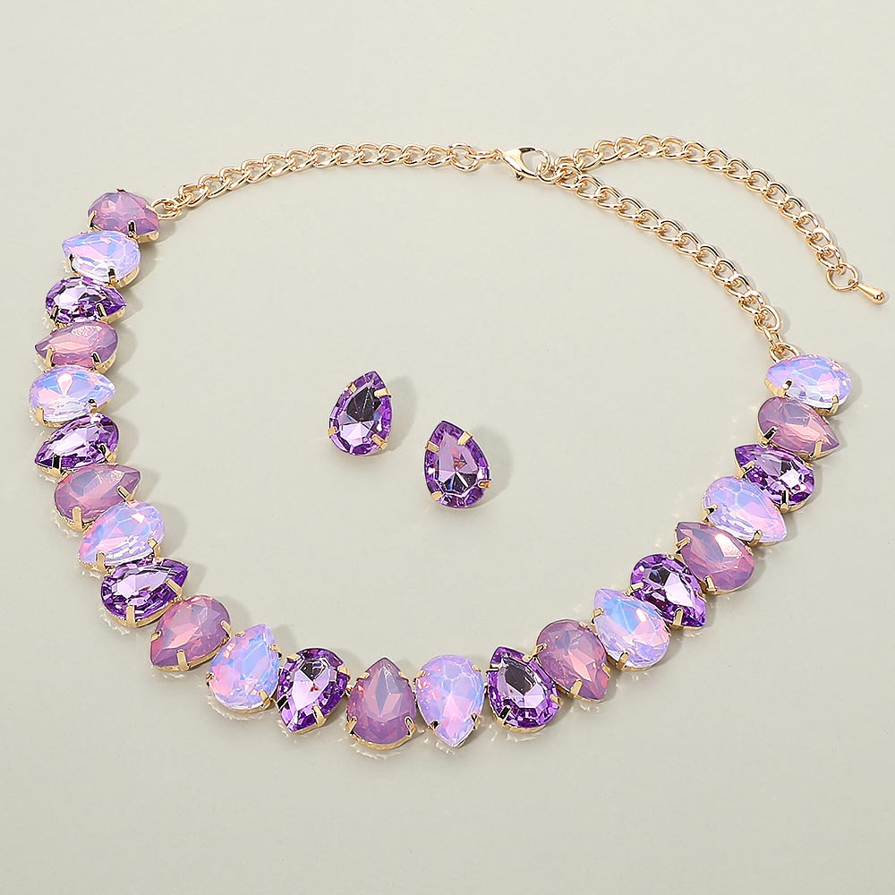 Multi-color purple teardrop crystal necklace set on gold displayed on light grey background