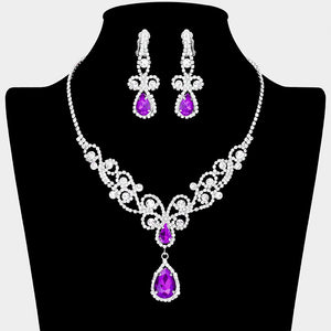 Purple teardrop crystal rhinestone vine necklace set with clip-on earrings on black bust