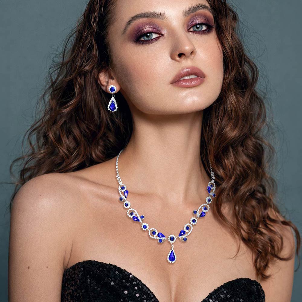 Model wearing Sapphire Teardrop and Rhinestone Floral Pageant Necklace Set | Special Event Jewelry
