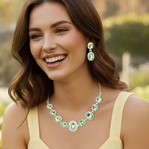 Woman wearing a Pave Trim Light Green Rhinestone Necklace and Earrings, silver backed, outdoors