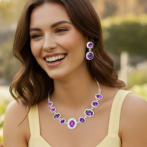 Woman wearing a Pave Trim Blue Rhinestone Necklace and Earrings, silver backed, outdoors