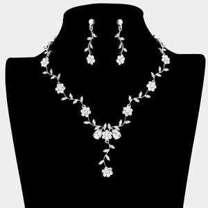 Clear crystal prom necklace set on silver with matching earrings displayed on a black mannequin bust on a white background.