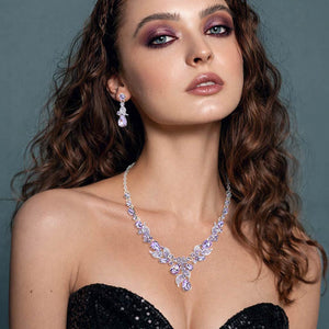 Model wearing Purple Amethyst teardrop leaf necklace set on silver with matching earrings for prom and evening wear