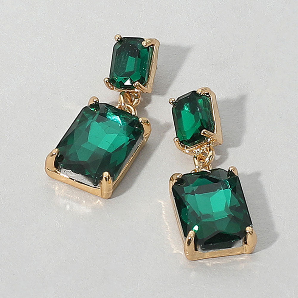 Rectangular Emerald Dangle Earrings on a white background