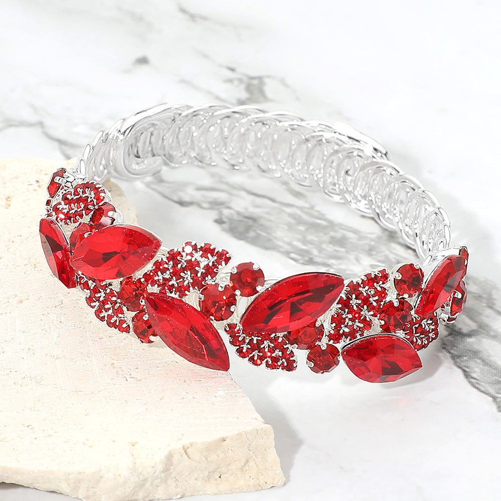 Red marquise stone cluster adjustable bracelet on silver on marble surface