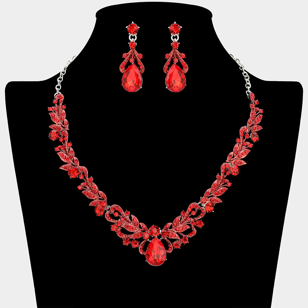 Red crystal teardrop leaf necklace and earring set styled for prom or evening wear, shown on a black mannequin bust on a white background