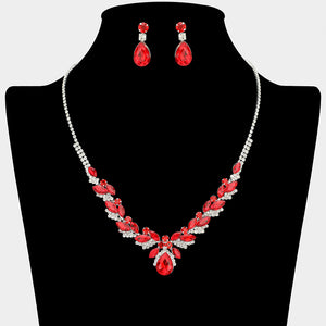 Red teardrop marquise prom necklace set on silver with matching earrings displayed on a black mannequin bust on a white background.