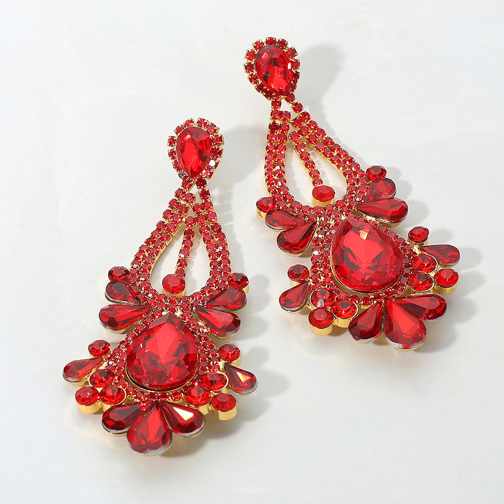 Red teardrop chandelier statement earrings for prom or pageant evening style on a white background