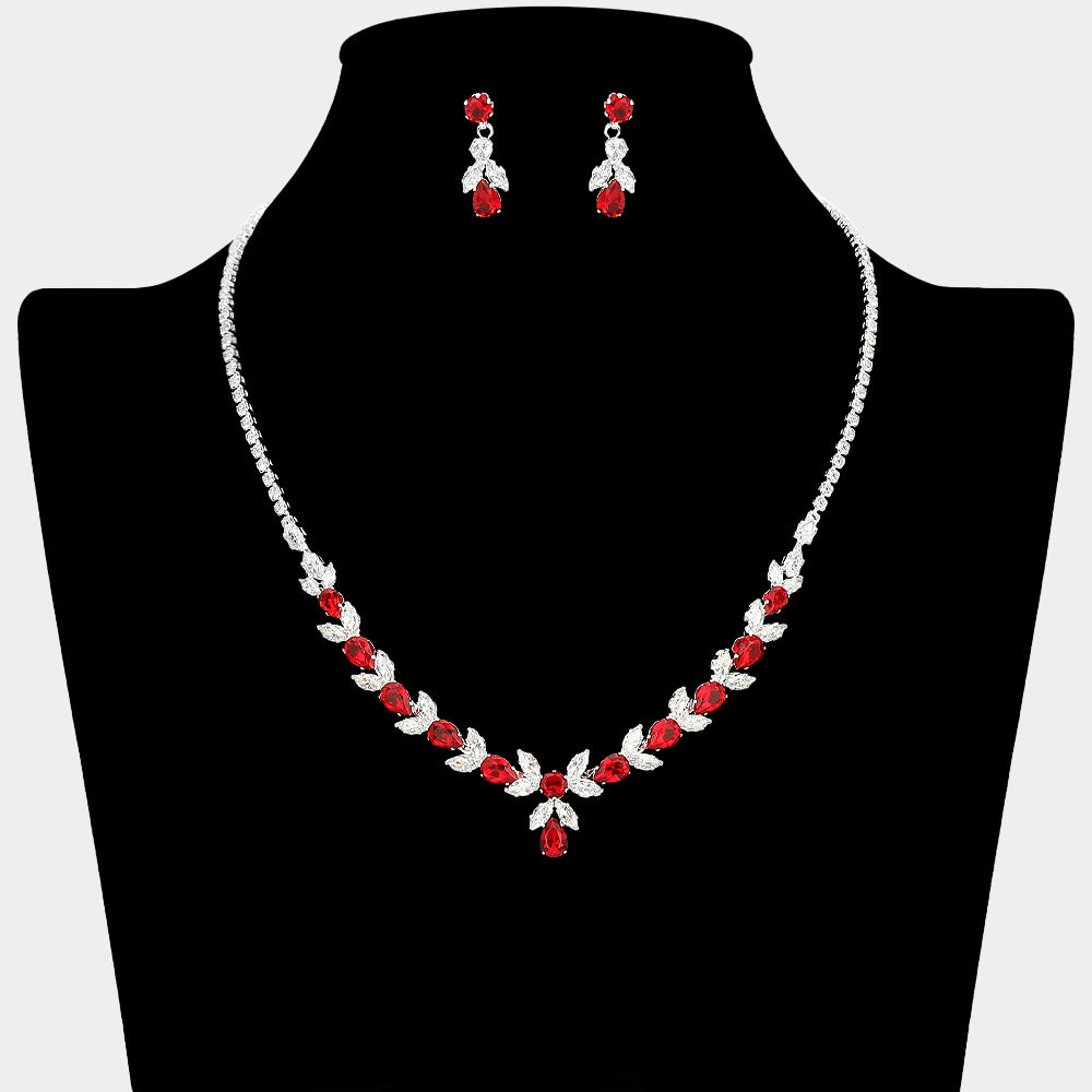Red and clear crystal delicate necklace set on silver with alternating marquise stones, a small center drop, and matching drop earrings, displayed on a black jewelry bust.