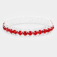 Clear glass bowl with red floral decorations on a white background