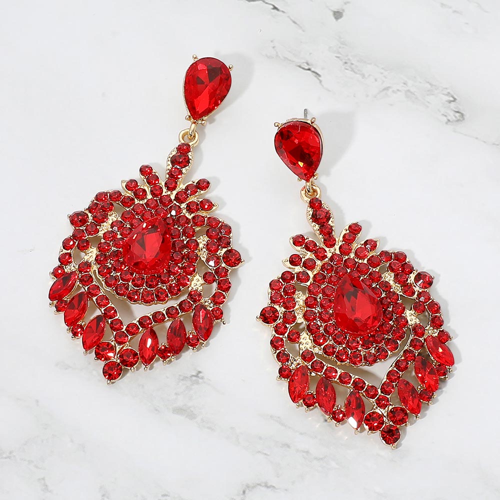 Red crystal teardrop chandelier statement pageant earrings on gold with an ornate layered crystal design, displayed on a white background.