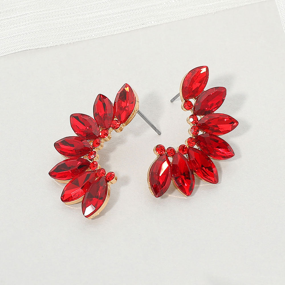 Red crystal marquise winged earrings on gold with layered marquise stones forming a wing-inspired design, displayed on a white background.