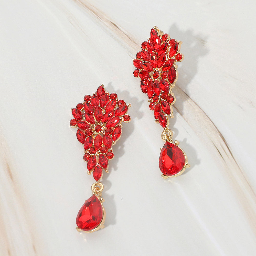 Red floral marquise cluster teardrop drop earrings on gold on white marble background