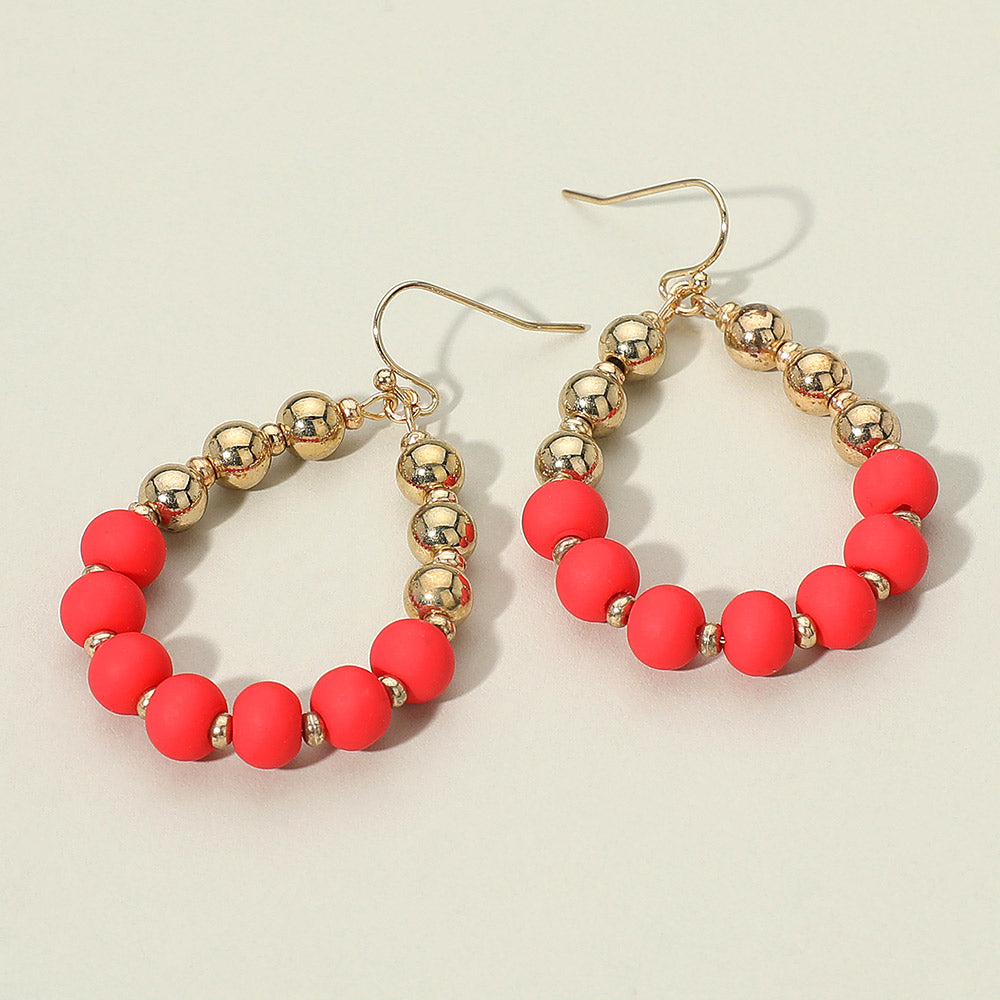 Red and gold ball teardrop statement earrings for fun fashion, runways, or pageants on a white background