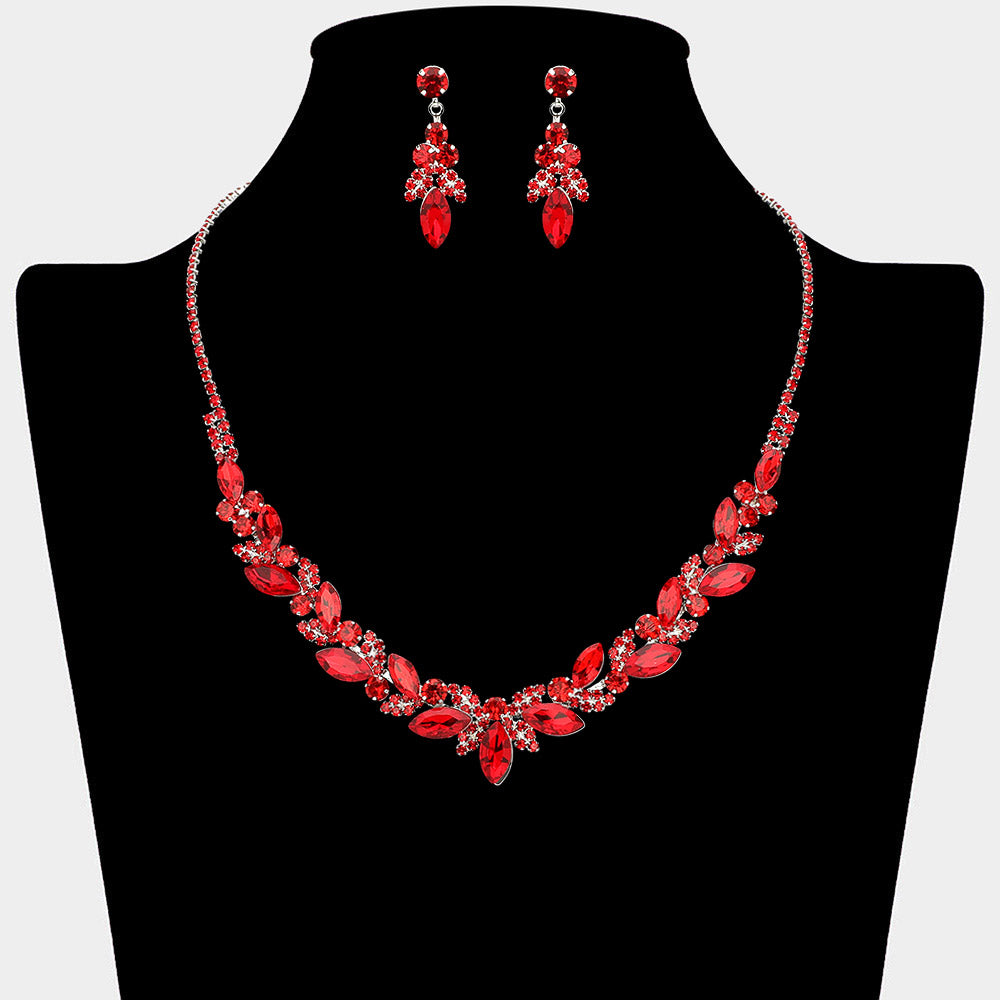 Red marquise leaf rhinestone necklace set on silver displayed on black bust background
